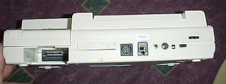The back of the machine features expansion cartridge, printer, serial, modem, barcode reader, and power connectors, as well as the power, reset, and contrast controls.